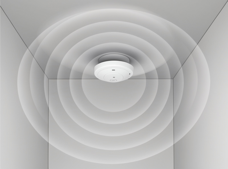 Wi-Fi access point on a ceiling with concentric coverage rings fading with distance through walls